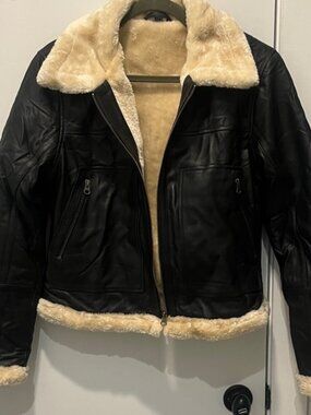 Elegant Black and Cream Shearling Leather Jacket